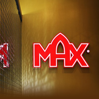 MAX Logo in bright red on wall. Photo.